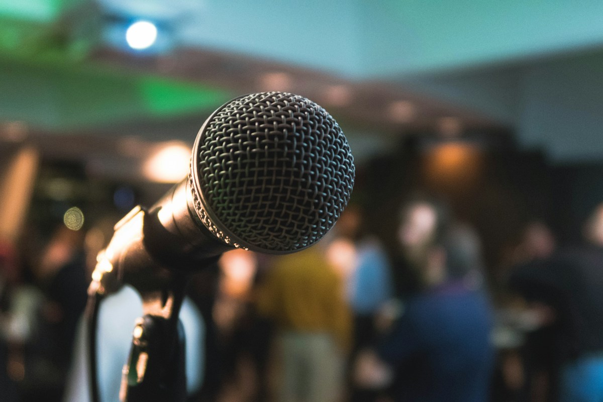 A speaker presenting to an adult audience